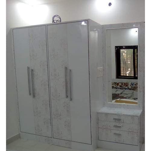 indian wardrobe design with dressing table Indian wardrobe design with study table and motifs on wardrobe